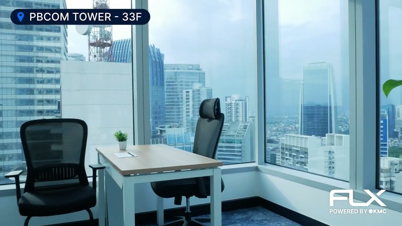 Modern pantry area with sleek cabinets and seating at KMC's office space on the 33rd floor of PBCom Tower, Makati.