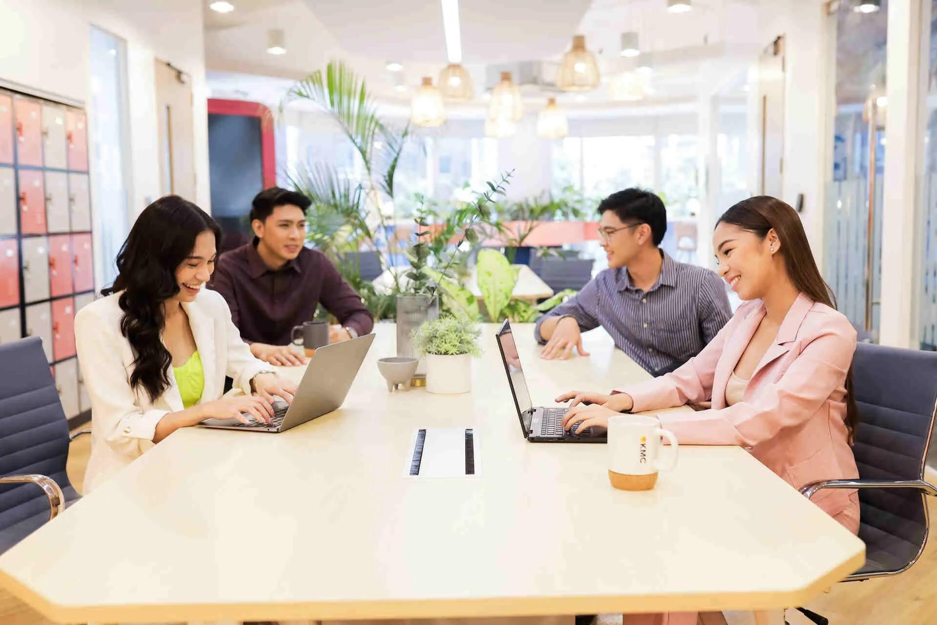 Colleagues at a business lounge discuss strategies, reflecting KMC's commitment to world-class talent and workforce solutions. Colleagues at a business lounge discuss strategies, reflecting KMC's commitment to world-class talent and workforce solutions.