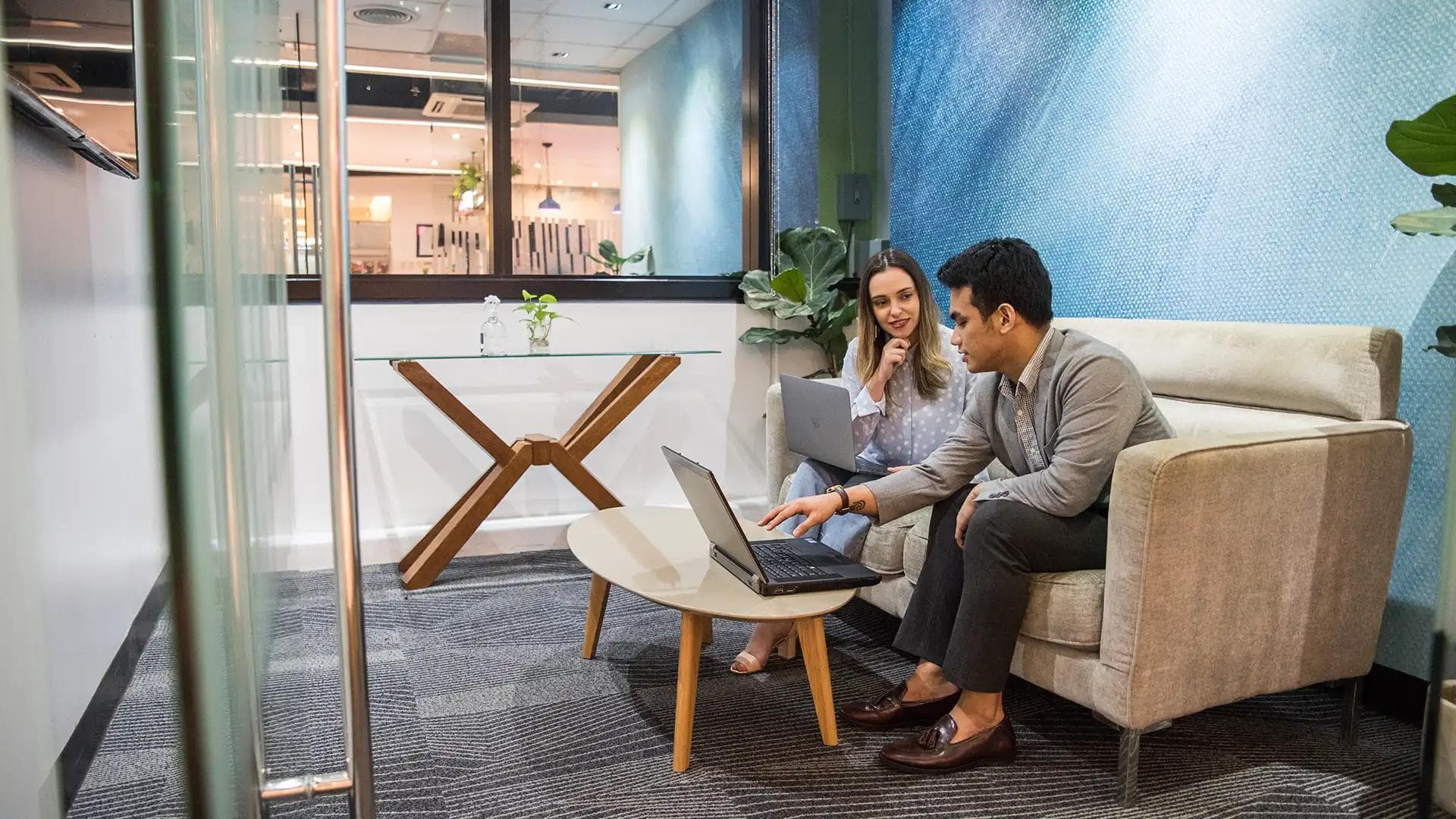 man and woman having a meeting at a KMC Meeting Room